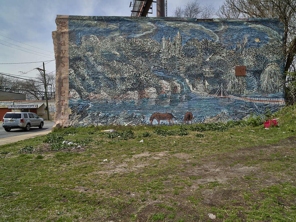 Community mural in Grays Ferry depicting the Schuylkill River landscape